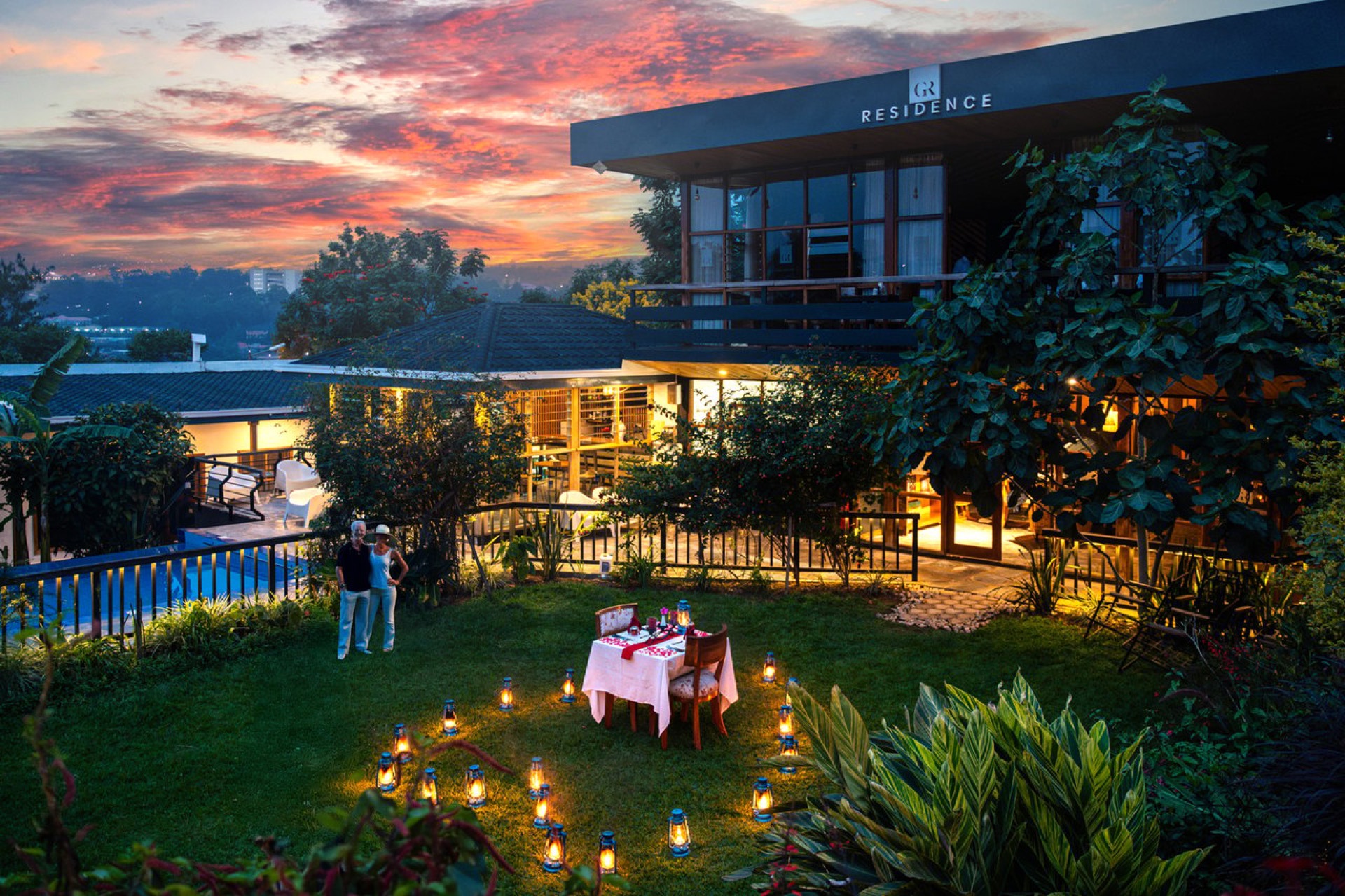 A table laid for dinner outdoors at sunset at a lodge near Kigali, Rwanda